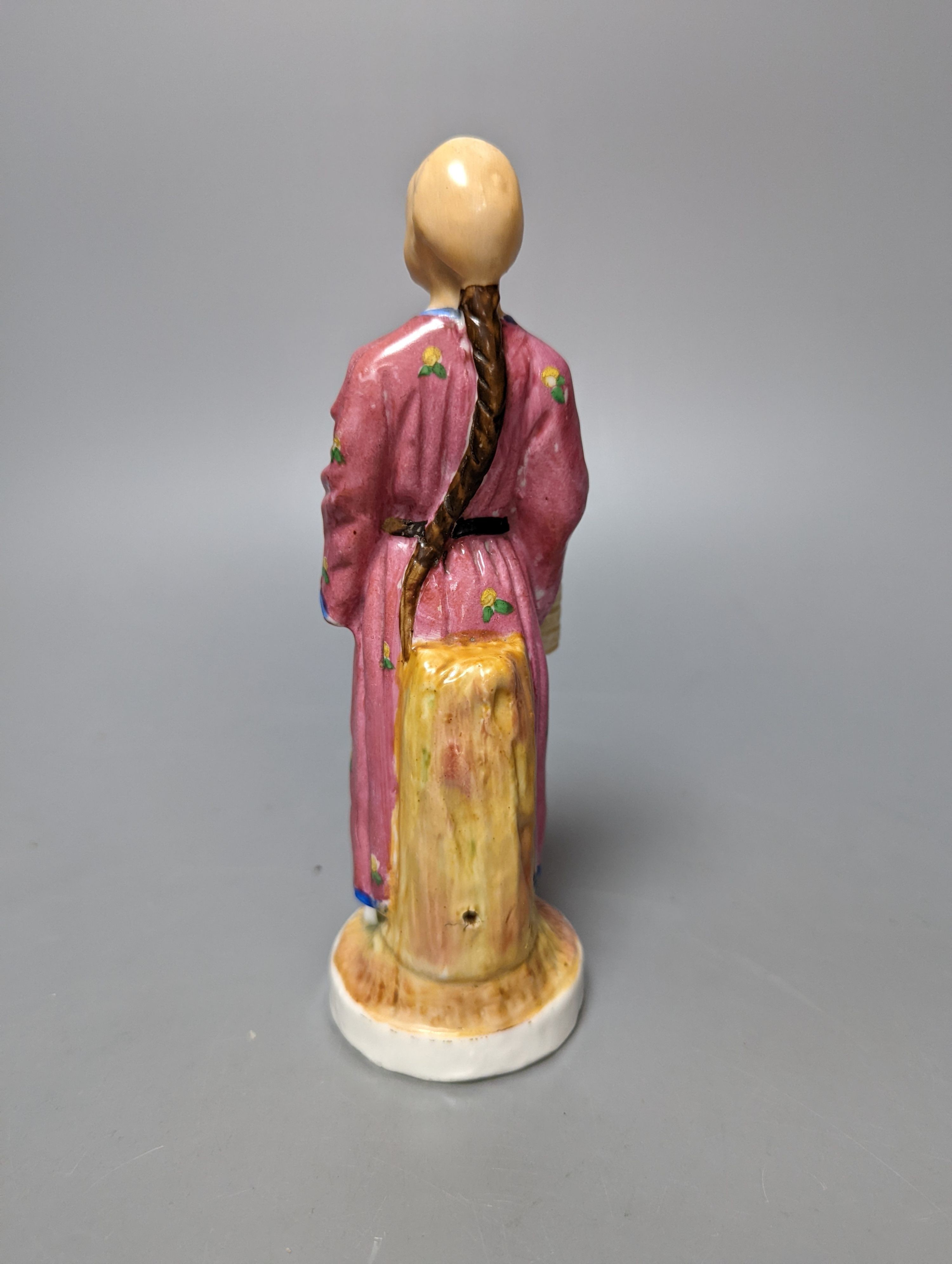 A 19th century French bisque classical female figure, Doulton Imari style teapot and a figure of an SPM porcelain figure of a Chinese man, base marked ‘SPM’. Tallest 34cm